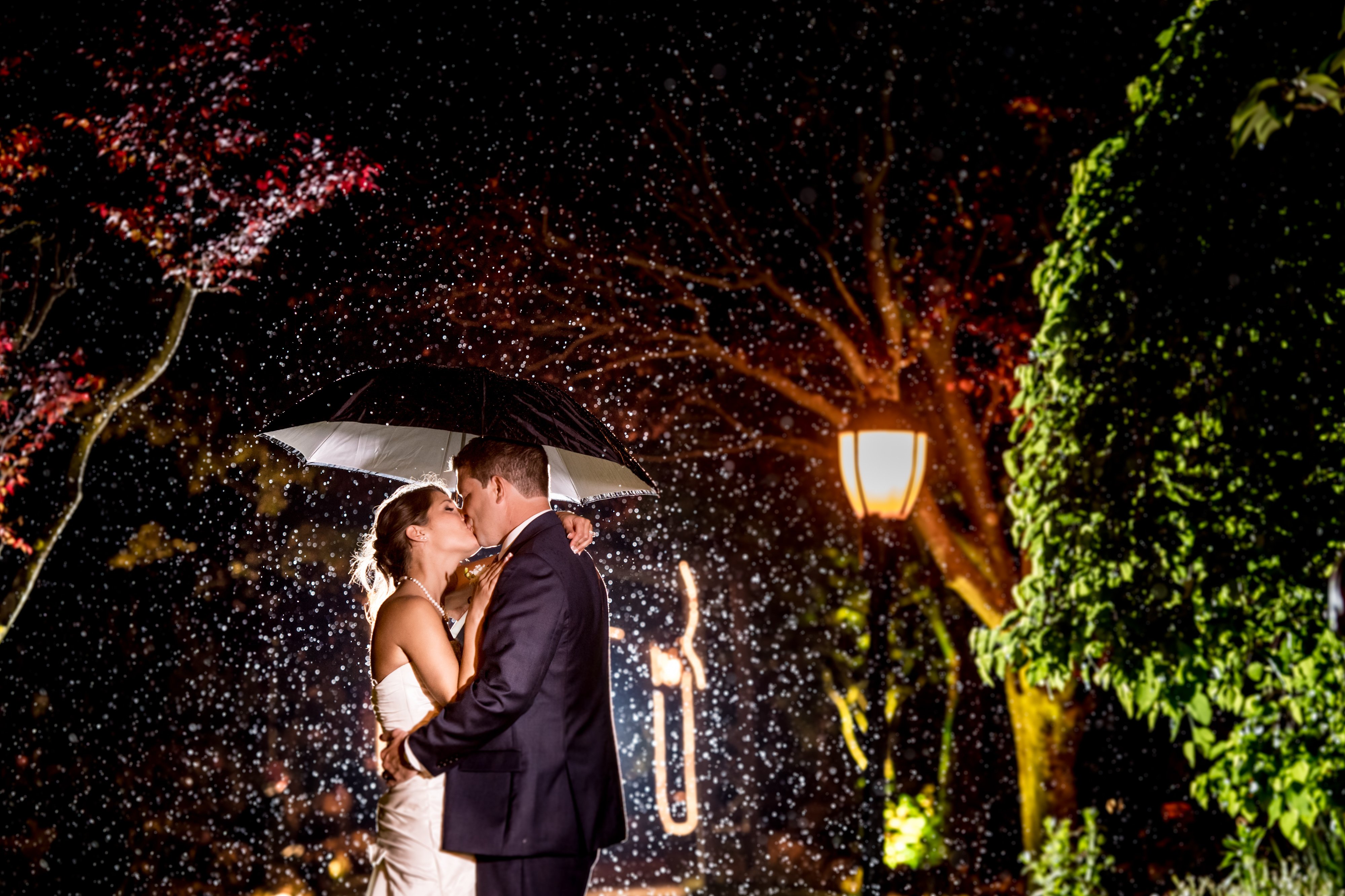 Bride and Groom Outside in the Rain at Swan Club | Lotus Wedding Photography